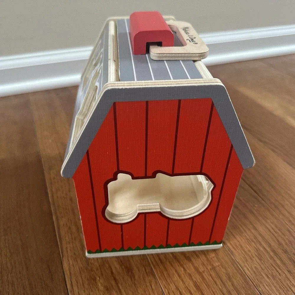 Melissa & Doug‎ Wooden Take-Along Sorting Barn Toy with Flip-Up Roof, 9 Pieces.